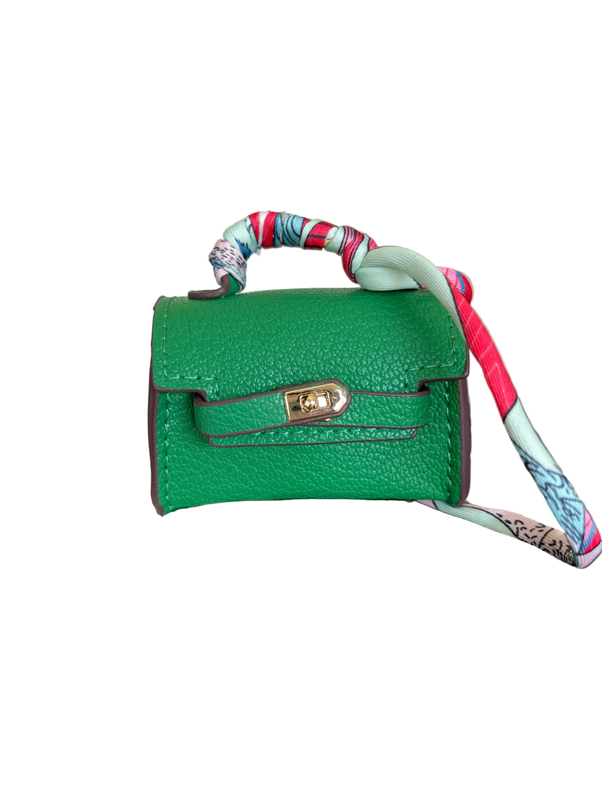A miniature green pebbled leather handbag with a colorful patterned silk strap and gold-tone hardware.